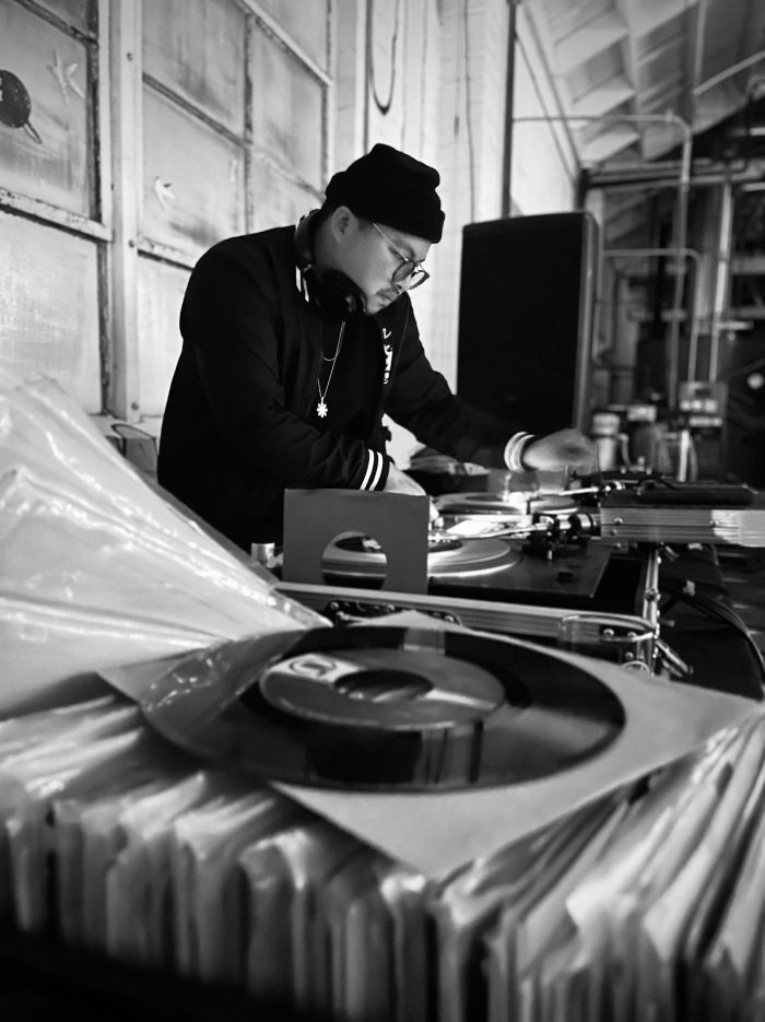 Photo of DJ spinning records